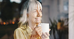 Coffee, thinking and window with senior woman in retirement home for memories or nostalgia. Relax, smile and wellness with happy mature person drinking caffeine beverage in apartment for weekend