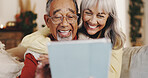 Home, funny and old couple on sofa, tablet and conversation with retirement, app and internet. Laughing, joke and senior man with elderly woman, tech and entertainment with online humor and comedy