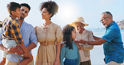 Buy stock photo Big family, children and playful with smile at beach with love, pride and care with bonding on holiday. Grandparents, men and women with kids, happy and excited for vacation by ocean in Colombia
