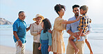 Big family, children and happy on holiday at beach with love, pride and care with bonding in summer. Grandparents, men and women with kids, smile and excited for play on vacation by ocean in Mexico