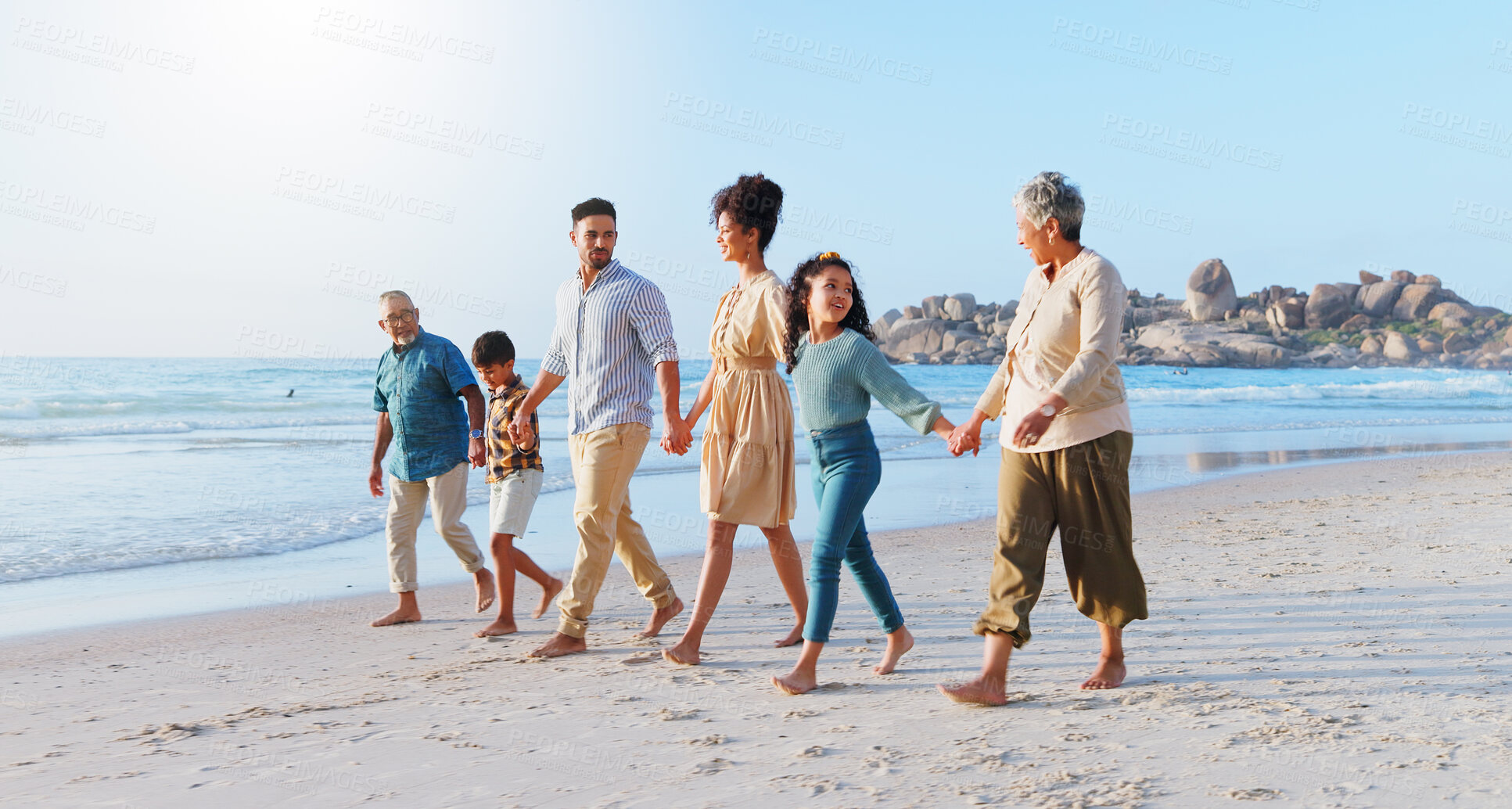 Buy stock photo Big family, walk and holding hands with kids on beach of summer holiday, travel and bonding together. People, children and journey on ocean for getaway, tropical vacation and adventure of generations