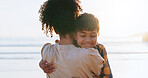 Back, hug and mother with son, ocean and bonding together with vacation, explore and relationship. Parent, family and mama with embrace, beach or summer holiday with tropical island, smile or journey