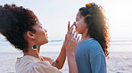 Mom, girl and sunscreen application at beach for uv protection, care and love on vacation in summer. Mother, child and lotion for face, skincare and bonding with smile by ocean on holiday in Brazil