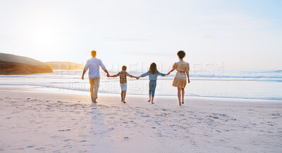 Buy stock photo Back, parents and holding hands with children on beach for summer holiday, travel and bonding together. Space, family and journey on ocean for getaway, tropical vacation and adventure of weekend trip