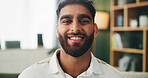 Portrait, smile and man in home for relax, peace and calm on weekend break in apartment. Face, living room and happy male person on comfortable sofa for resting and chill with confidence in UAE