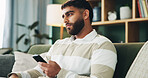 Home, man and sad with thinking for smartphone, online message and breakup with contact on sofa. House, male person and broken heart with tech for bad news, social media and rejection on dating app
