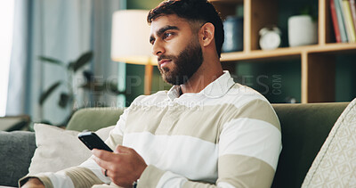 Buy stock photo Home, man and sad with thinking for smartphone, online message and breakup with contact on sofa. House, male person and broken heart with tech for bad news, social media and rejection on dating app