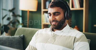 Buy stock photo Headphones, music and man with laptop for elearning, remote education and listening to audio in home. Living room, computer and happy student with sound for college course, knowledge or study online