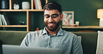 Sofa, happy man and reading on laptop for remote work, online information and story for publication. Home, freelancer and male content writer with digital for research, copywriting or article website