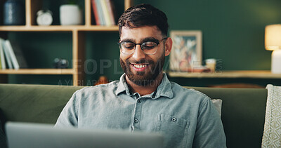 Buy stock photo Sofa, happy man and reading on laptop for remote work, online information and story for publication. Home, freelancer and male content writer with digital for research, copywriting or article website