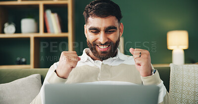 Buy stock photo Man, fist pump and laptop on couch with celebration, excited and winning with online giveaway in home. Person, computer and happy with goal, success and profit with investment in living room at house