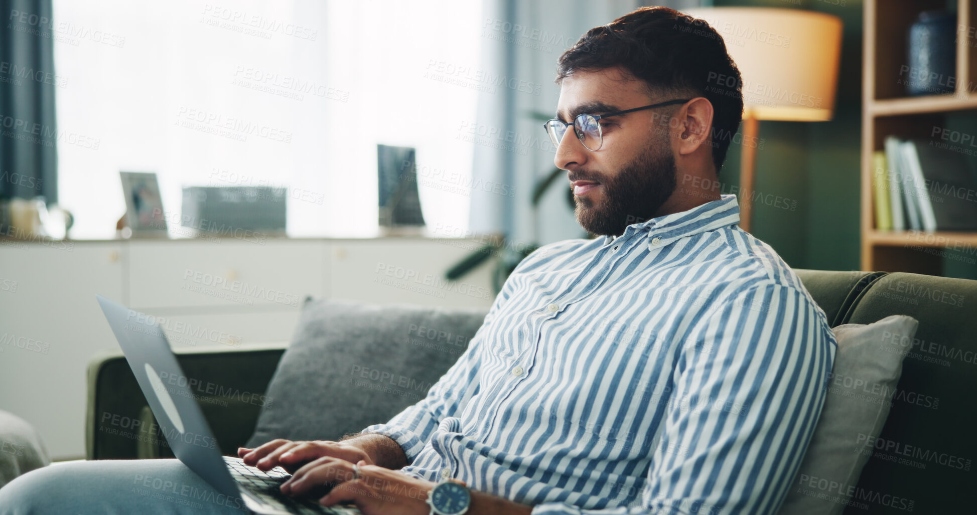 Buy stock photo Home, man and typing on laptop for remote work, online information and story for publication. Sofa, freelancer and male content writer with tech for research, copywriting and article website in house