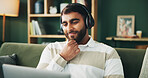 Man, laptop and relax with headphones on sofa for streaming music, watching online movie or social media. Happy, person and tech in home for film audio, listening to podcast and video entertainment