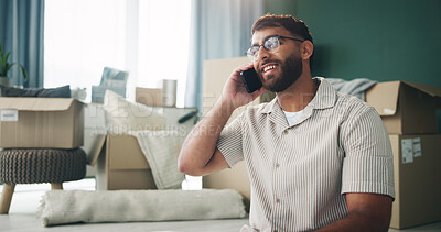 Buy stock photo Home, phone call and man in lounge, boxes or conversation with new property, talking or smile. Real estate, moving and person with cardboard, lease or schedule for courier, speaking and investment