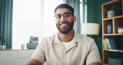 Buy stock photo Portrait, glasses and happy man in apartment for relax, peace or calm on weekend break in home. Smile, living room and male person with spectacles for vision, resting and chill with confidence in UAE