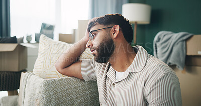 Buy stock photo Boxes, depression and thinking with man on sofa in living room of home for mortgage failure or mistake. Grief, loss and sad with unhappy person in apartment for bankruptcy, debt or eviction crisis 