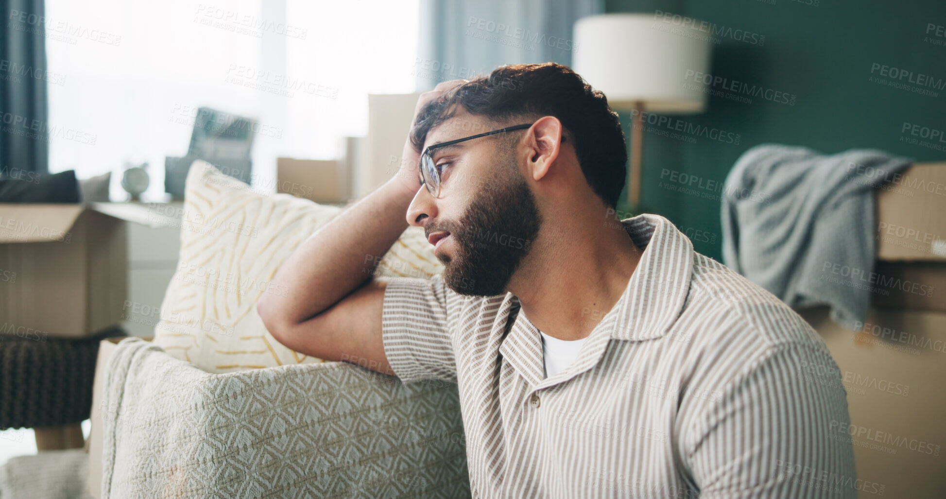 Buy stock photo Boxes, depression and thinking with man on sofa in living room of home for mortgage failure or mistake. Grief, loss and sad with unhappy person in apartment for bankruptcy, debt or eviction crisis 