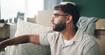 Buy stock photo Home, man and boxes with stress for thinking, contemplation and serious with packing for eviction. Apartment, male person and sad with thoughts for relocation, rent and moving out in living room