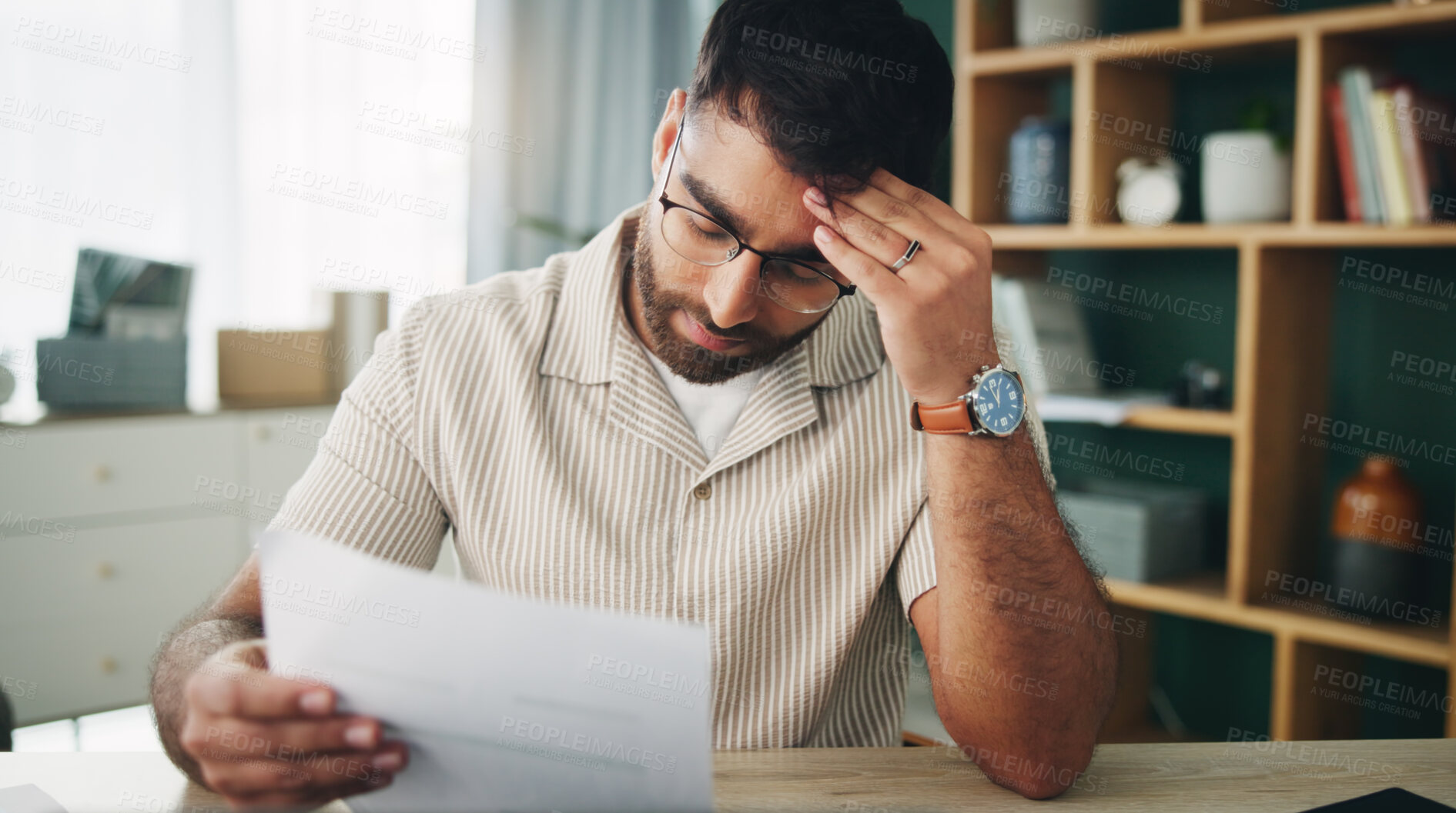 Buy stock photo Remote work, man and headache in home with paperwork, mistake and finance crisis in startup. Entrepreneur, mental health and doubt in living room with invoice, document and upset for business debt