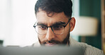 Home, remote work and man with laptop for reading, solution and online story for publication. House, freelancer and content writer with tech for research, problem solving or article website in office
