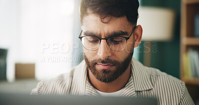 Buy stock photo Home, man and freelancer with laptop for reading, solution and online story for publication. House, remote work and content writer with tech for research, problem solving of article website in office