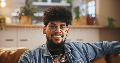 Buy stock photo Student, glasses and portrait of man on sofa in living room for smile, gen z youth and relaxing. Happiness, pride and scholarship opportunity with person in lounge of home for calm, chill and future