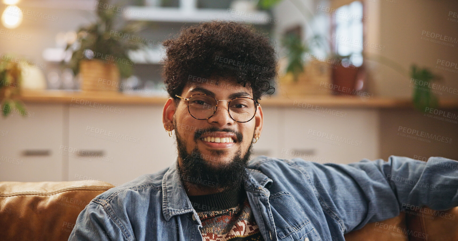 Buy stock photo Student, glasses and portrait of man on sofa in living room for smile, gen z youth and relaxing. Happiness, pride and scholarship opportunity with person in lounge of home for calm, chill and future
