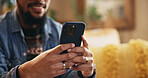 Man, hands and typing with phone on sofa for dating site chat, text message and social media scroll. Closeup, person and relax with smartphone in home for subscription, app download and online search