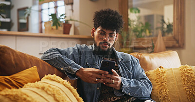 Buy stock photo Man, relax and typing with phone in home for mobile chat, reading online news and internet browsing. Person, connection and smartphone on sofa for streaming subscription, social media or playing game
