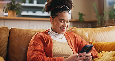 Buy stock photo Girl, smile and typing with phone on sofa for dating site, mobile chat or reading online news. Gen z person, relax or happy with smartphone in home for streaming service, social media or app download