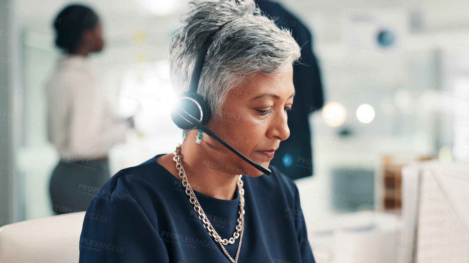Buy stock photo Mature woman, agent and talking with headset at call center for online communication or customer service. Female person, consultant or employee with mic or technology for virtual assistance at office