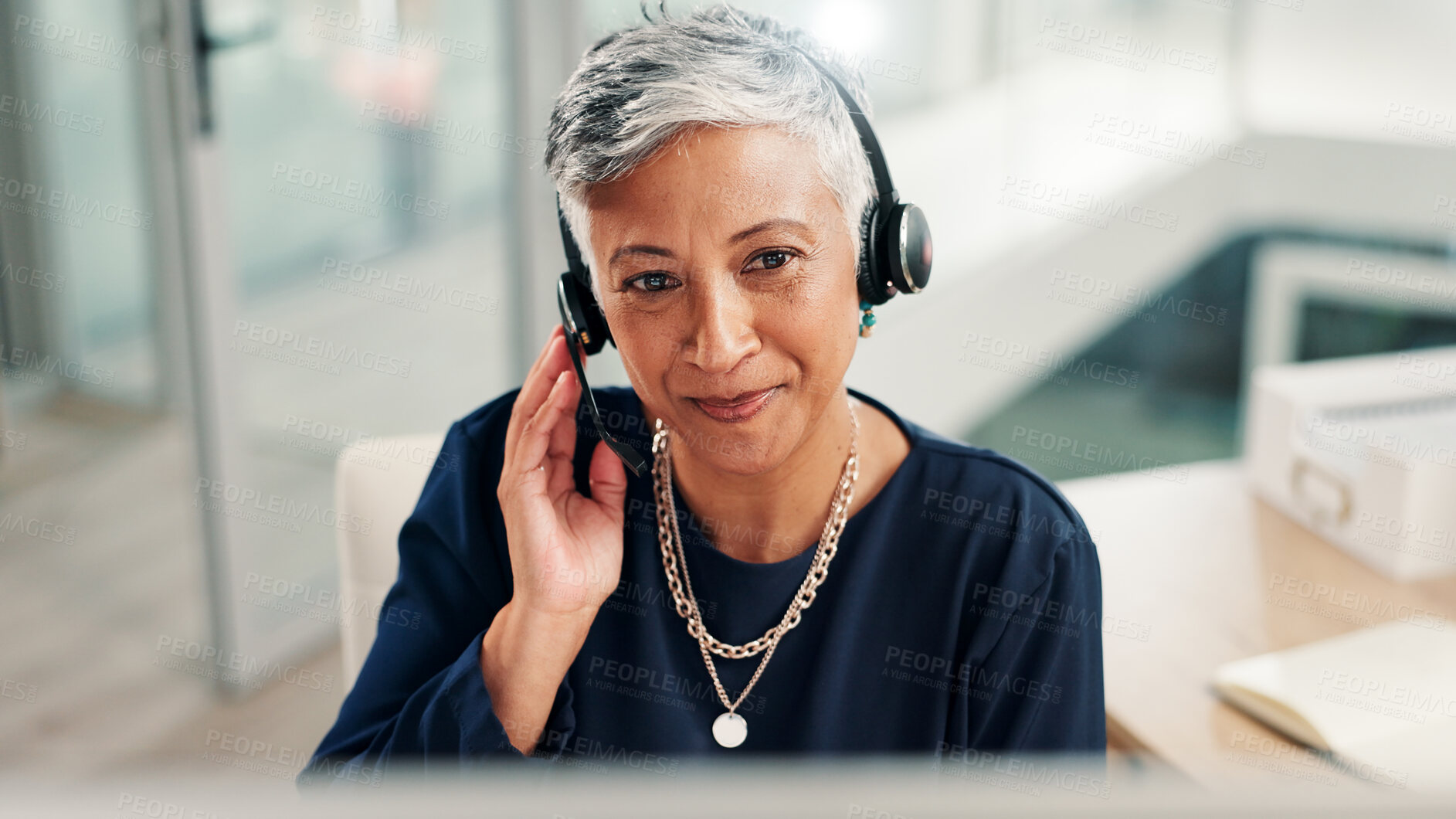Buy stock photo Mature, happy woman or agent talking with headset at call center for online communication. Female person, consultant or employee with mic or technology for virtual assistance or customer service