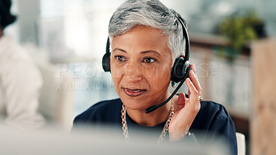 Buy stock photo Mature woman, consultant and listening with headset on computer for online advice or customer service. Female person, agent or employee with mic or technology for virtual assistance at call center