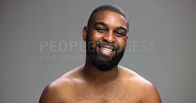 Buy stock photo Portrait, cosmetics and black man in studio, smile and dermatology on gray background. African person, mockup space and happy model with skincare, grooming and shine with glow, confidence or wellness