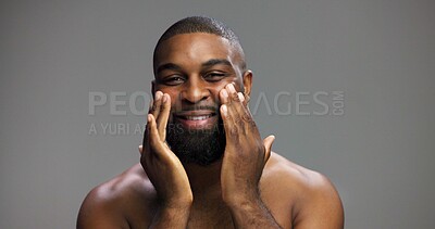 Buy stock photo Smile, skincare and portrait of black man in studio for beauty, grooming and dermatology. Cosmetics, facial glow and self care with male person on gray background for hydration, hygiene and shine