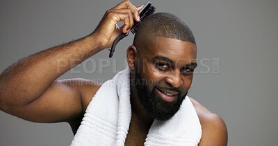 Buy stock photo Black man, portrait and brush hair in studio for grooming, morning routine and self care maintenance. Haircare, space and person with cosmetics tool on gray background for clean style and confidence