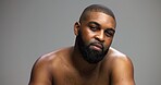 Beauty, skincare and portrait of black man in studio for salon, grooming and dermatology. Cosmetics, glow and self care with person and facial on gray background for hydration, hygiene and shine