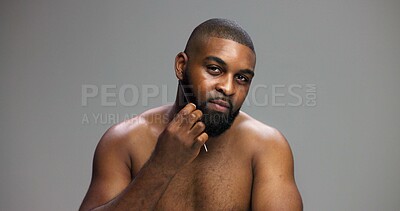 Buy stock photo Man, portrait and comb beard in studio for grooming routine, detangle facial hair and self care maintenance. Mockup space, black person and cosmetics tool on gray background for styling and hygiene
