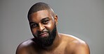 Portrait, skincare and black man in studio, dermatology and cosmetics on gray background. African person, mockup space and happy model with self care, grooming and shine with glow, beauty or wellness