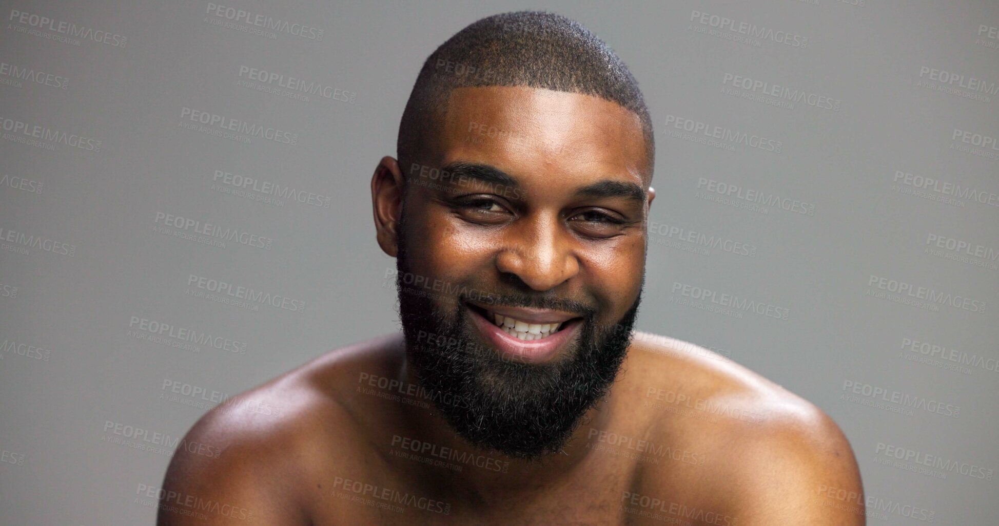 Buy stock photo Portrait, dermatology and black man in studio, smile and cosmetics on gray background. African person, mockup space and happy model with skincare, grooming and shine with glow, beauty and self care