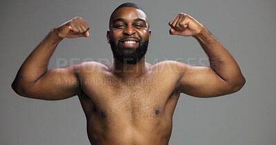 Buy stock photo Smile, power and black man flexing in studio portrait with health, wellness and confidence in biceps progress. Bodybuilder, muscle fitness and strong arms of happy person on grey background.