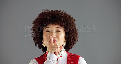 Buy stock photo Wink, secret and woman with finger on lips for silence, private or confidential news on gray background. Gossip, whisper or shush in portrait, rumor or studio space with communication for quiet