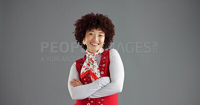 Buy stock photo Happy, crossed arms and portrait of woman in studio with trendy clothes, cool style and retro outfit. Mockup space, fashion and isolated person with confidence, pride and smile on gray background