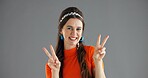 Portrait, smile and woman with peace sign in studio for retro fashion on gray background space. Happy, hand gesture and person with v symbol for victory, achievement emoji or winning with success