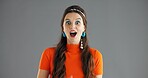 Woman, portrait and shock news in studio, wow reaction or expression with open mouth on gray background. Surprise, announcement or mockup space with revelation, mind blown or positive opportunity