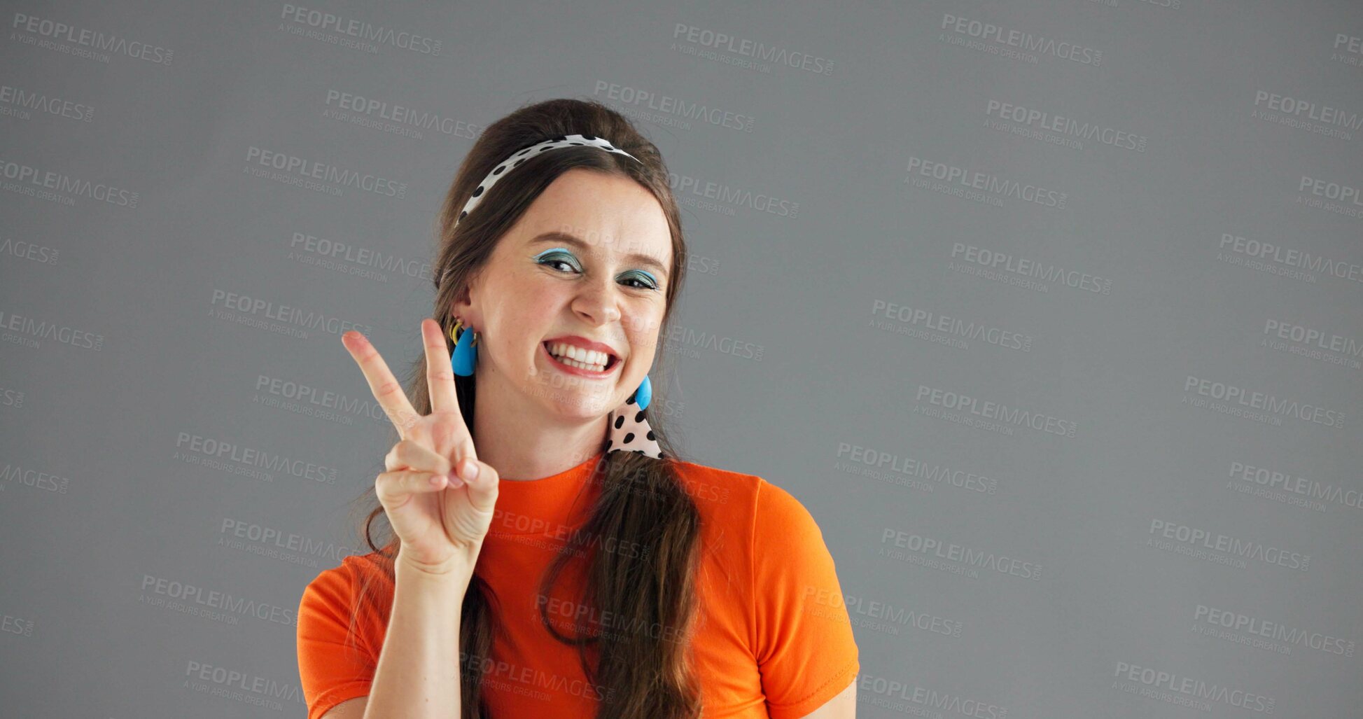 Buy stock photo Portrait, smile and woman with peace sign for fashion on gray background mockup space with retro style. Happy, hand gesture and person with v symbol for victory, winning emoji and success in studio