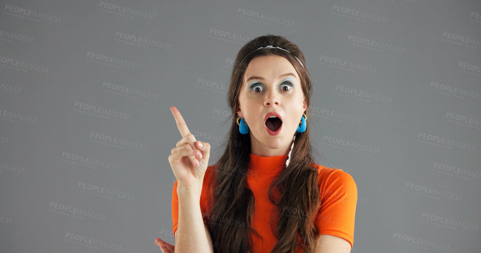 Buy stock photo Woman, pointing and shock info in studio for advertising, announcement wow or news about us on gray background. Mockup space, portrait or coming soon with sign or direction for surprise launch