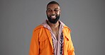 Fashion, happy and portrait of black man in studio to model retro clothes, outfit or style. Confident, satisfaction and smile with African person isolated on gray background for vintage aesthetic