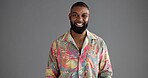 Black man, retro fashion or portrait in studio with smile, confidence or aesthetic for creativity. Person, designer and vintage style on gray background space with happiness, colorful print or unique
