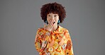 Surprise, gossip and portrait of woman in studio with announcement, good news or secret with wow. Mockup space, shock and female person with amazed, excited or OMG face expression by gray background.